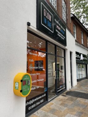 A Defibrillator on a shop wall
