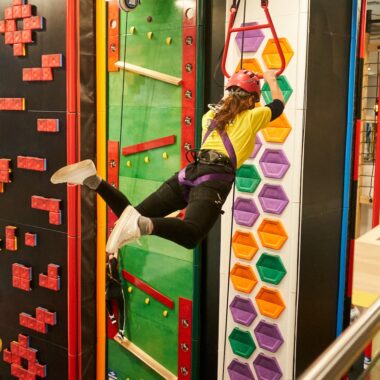 Person jumping on a high ropes course